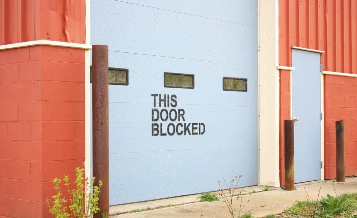 Bright Wall with the words THIS DOOR BLOCKED