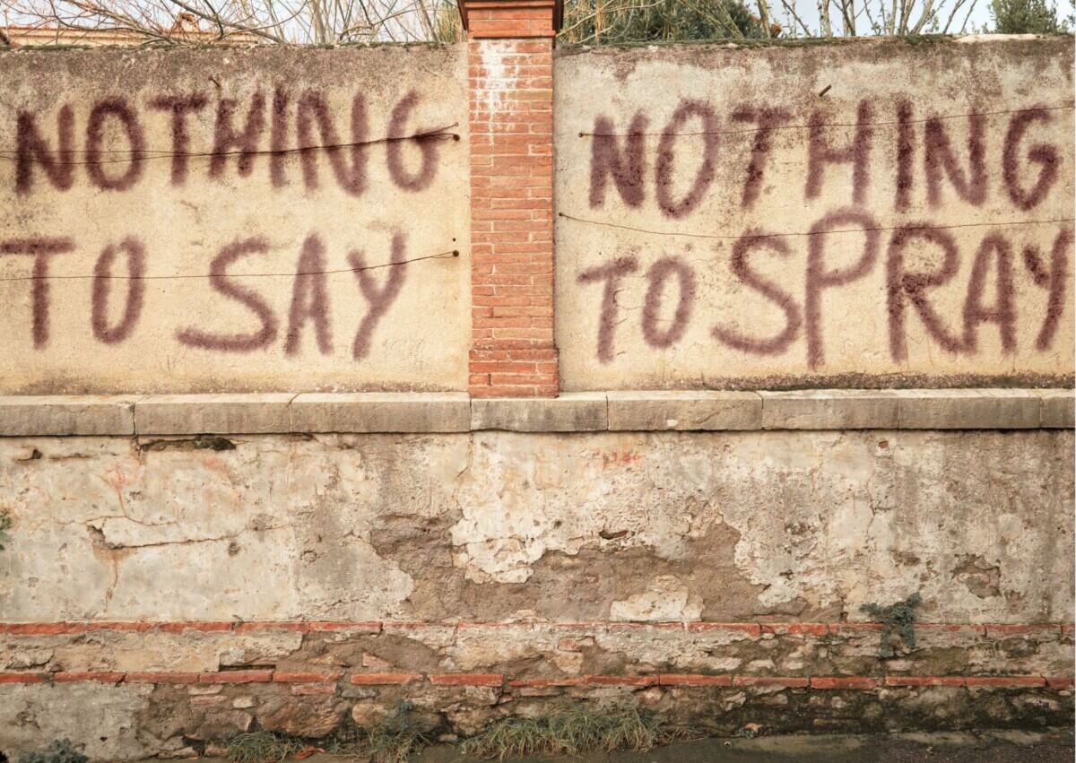 Graffiti on a wall that reads 'Nothing to say Nothing to spray'